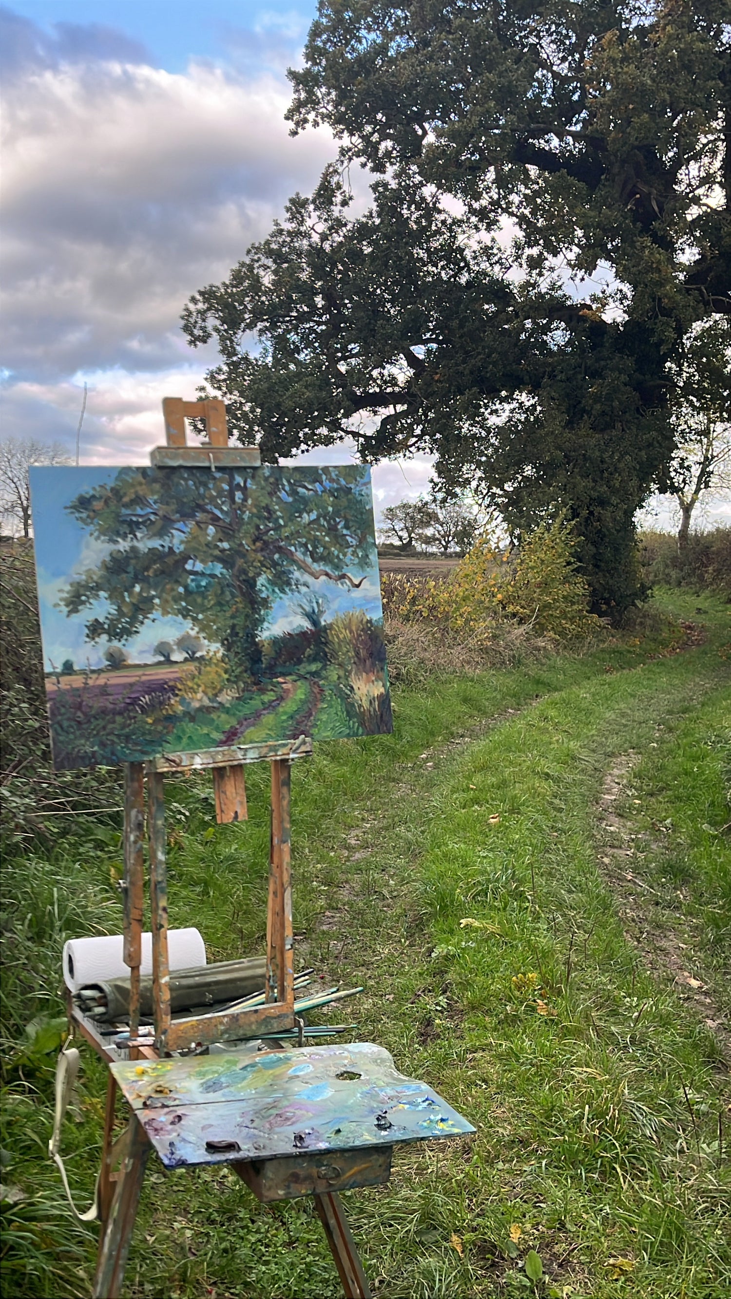 Corner Oak - Painting of a landscape on an easel outdoors with trees and grass in the background -  original landscape oil painting of the North Yorkshire countryside by artist Jeff Parker